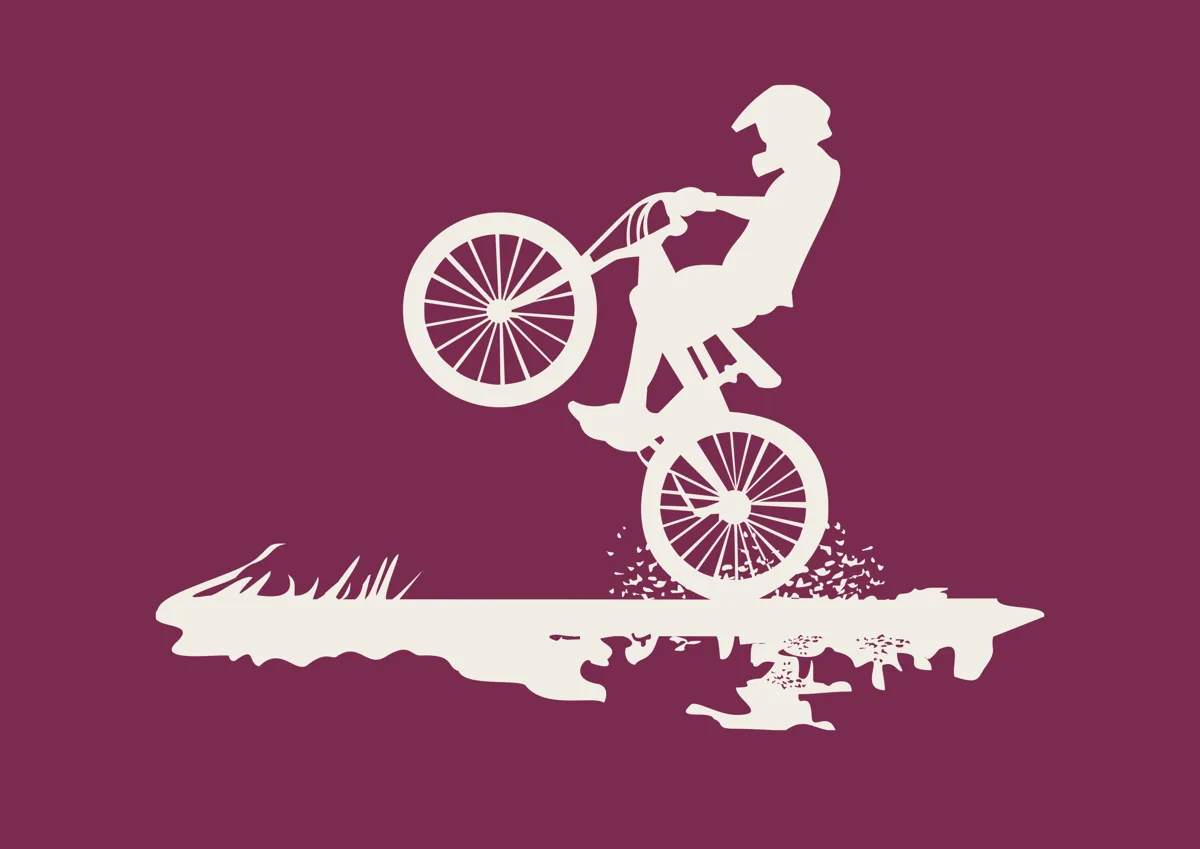 BMX rider jumping in the air, silhouette