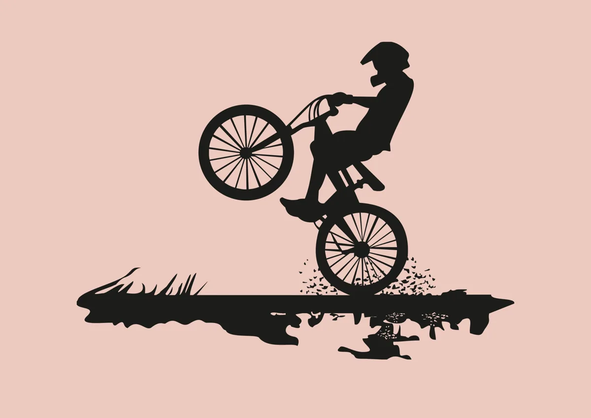 BMX rider jumping in the air, silhouette