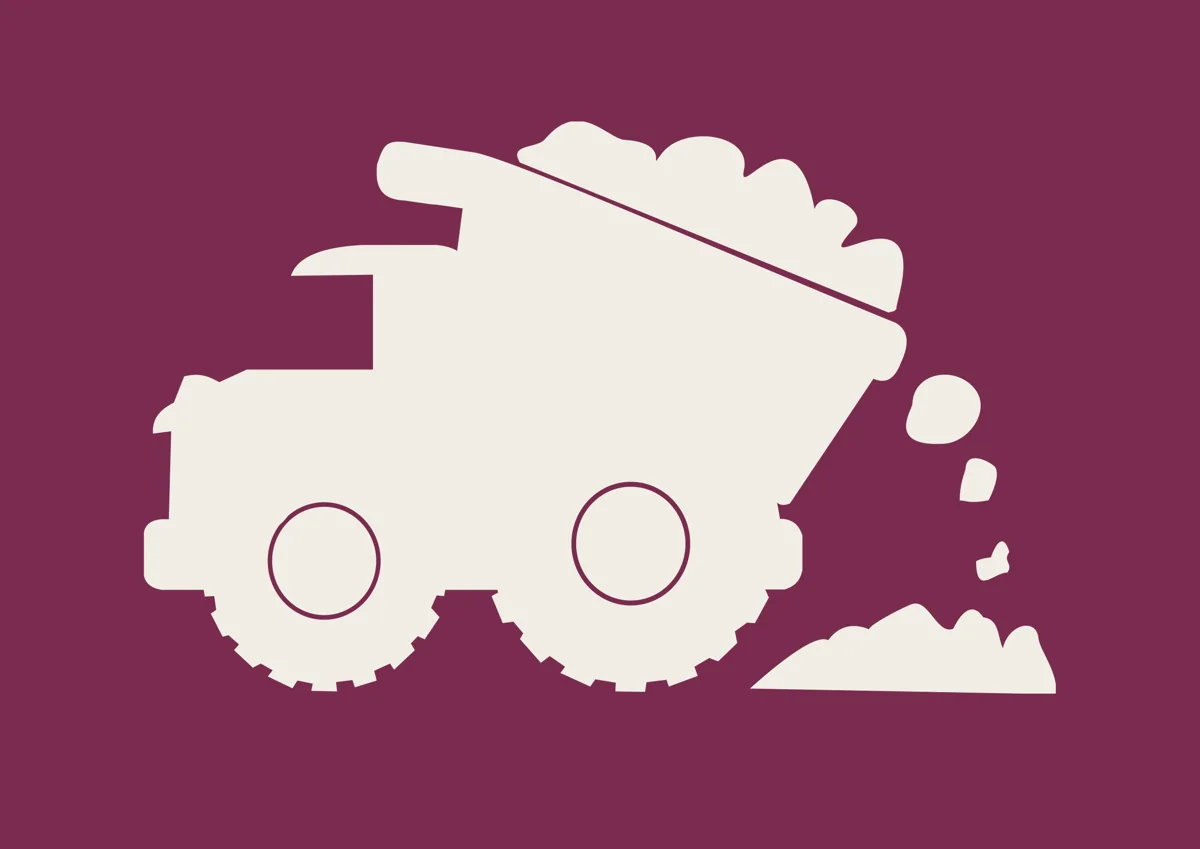 Chunky dump truck tipping its load, silhouette