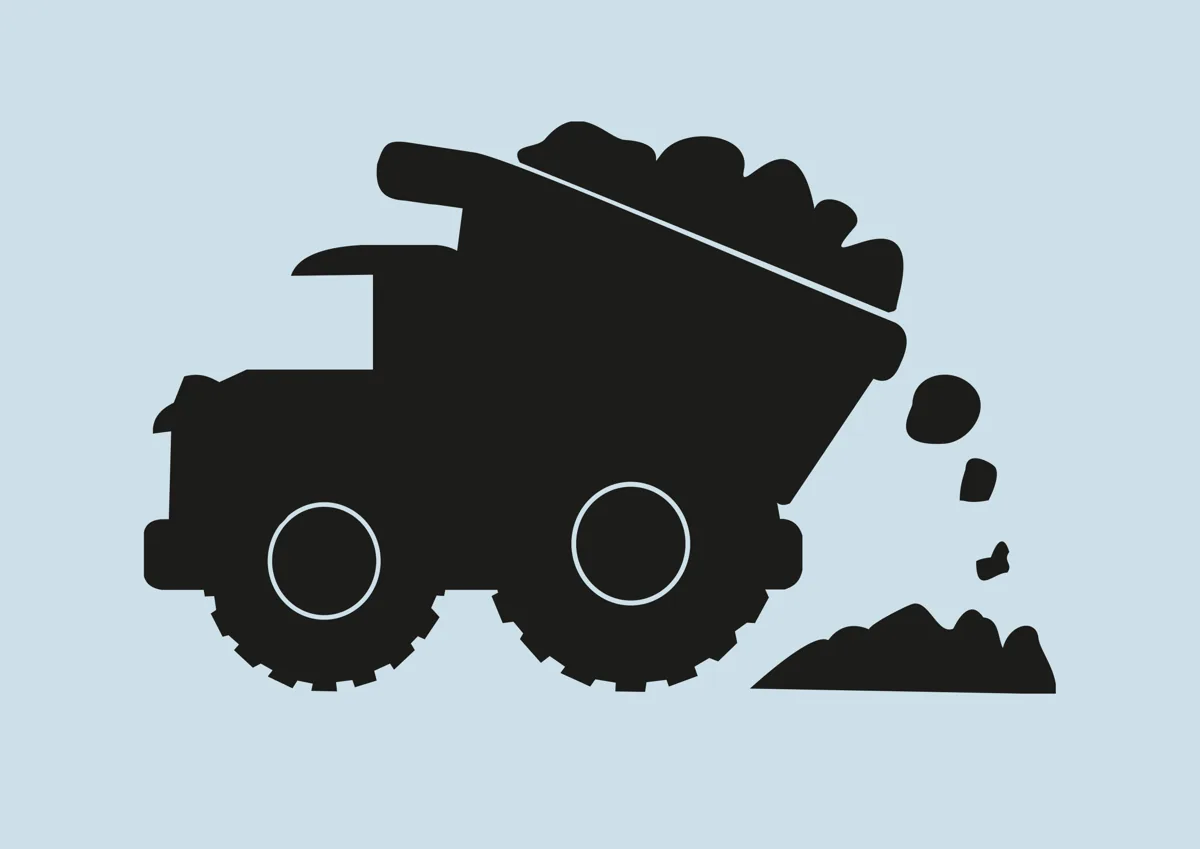 Chunky dump truck tipping its load, silhouette