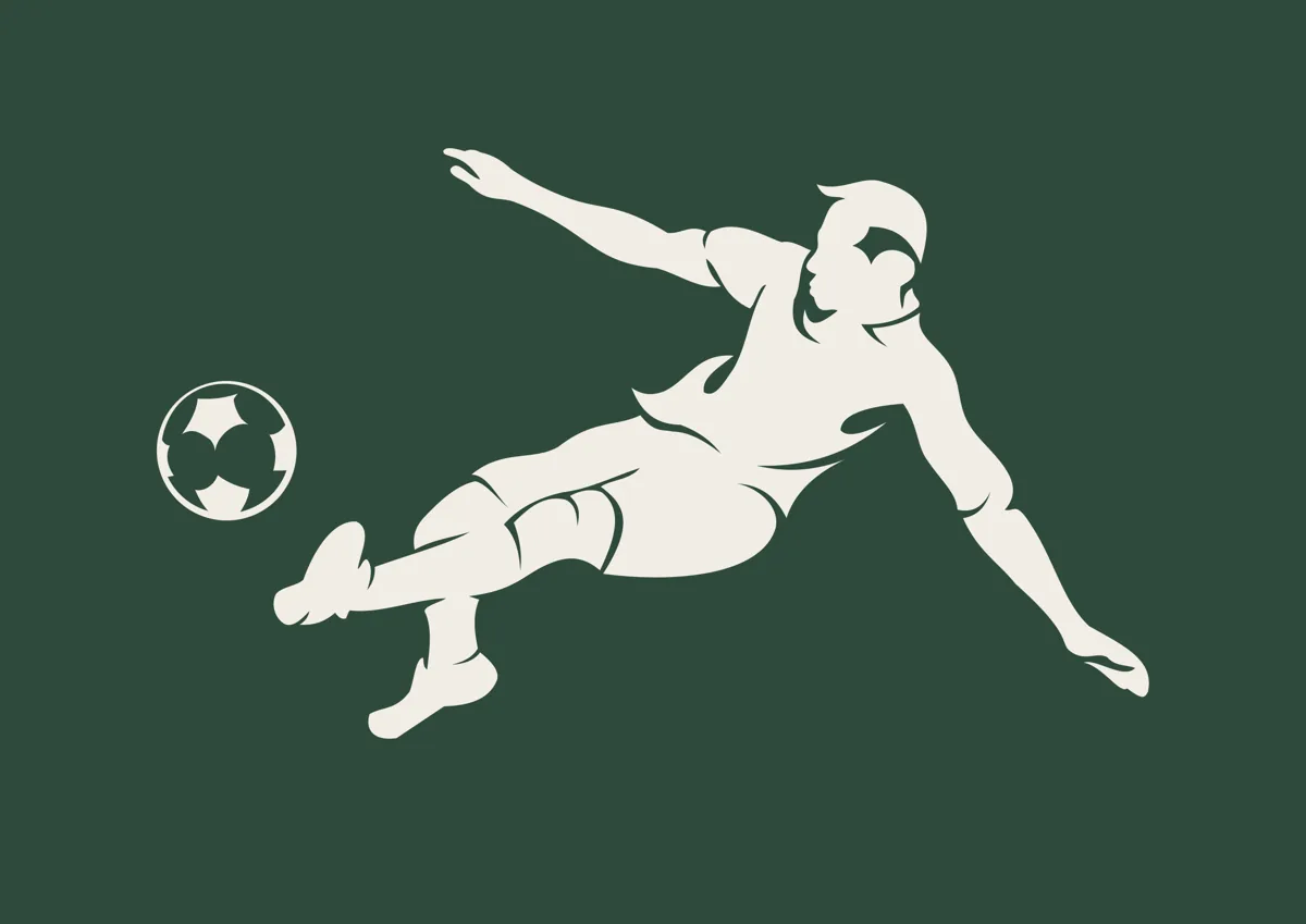 Footballer leaping to volley the ball, silhouette