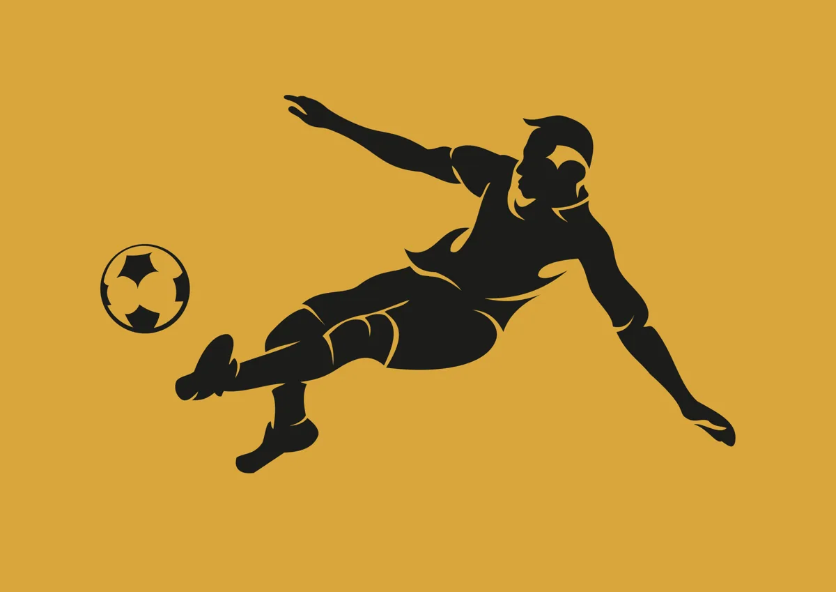 Footballer leaping to volley the ball, silhouette