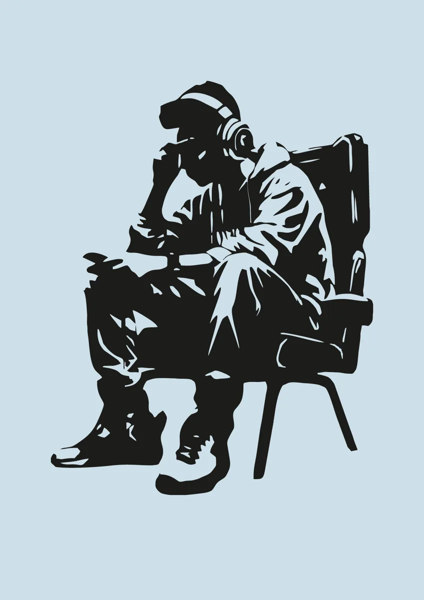 Gamer sitting in a chair with hood up holding a controller