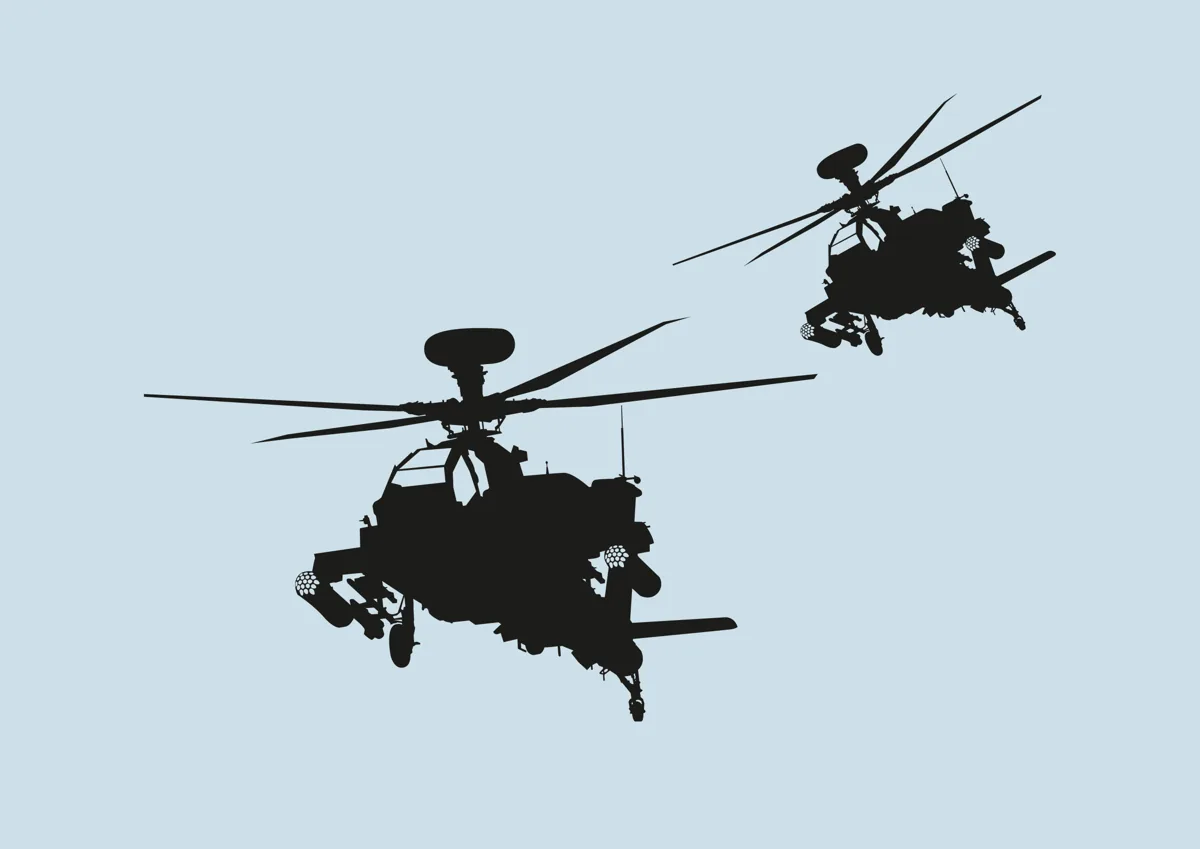 Two military helicopters in flight, silhouette