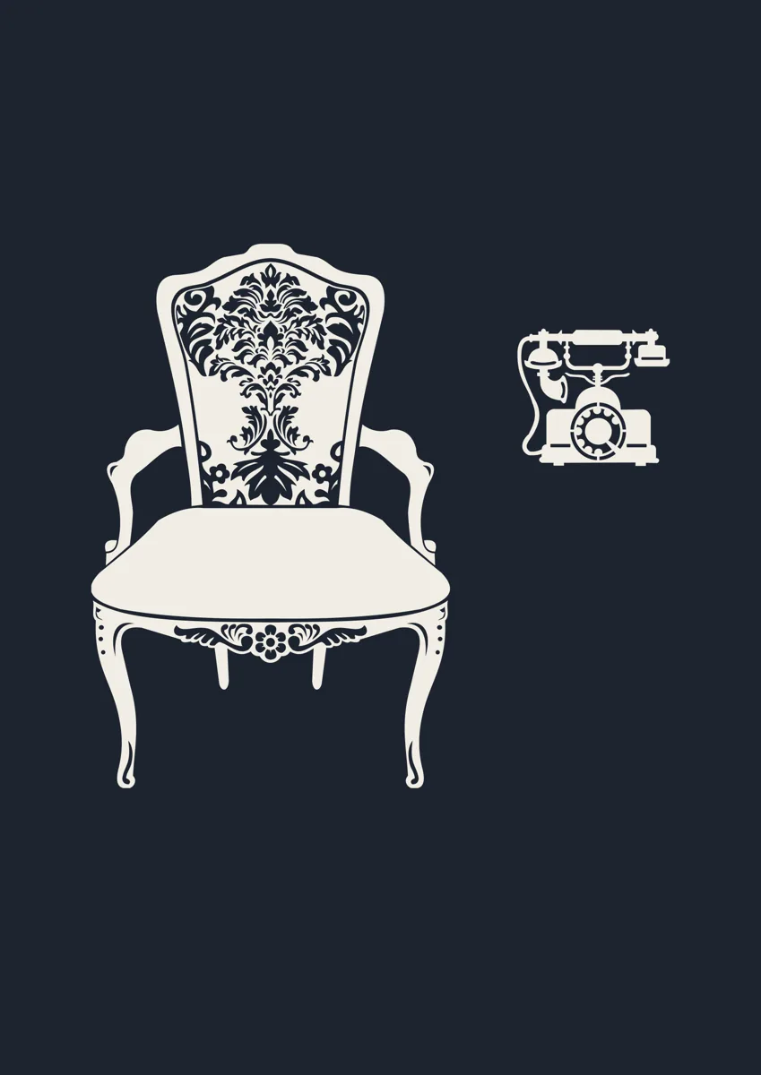Ornate armchair beside a vintage rotary telephone